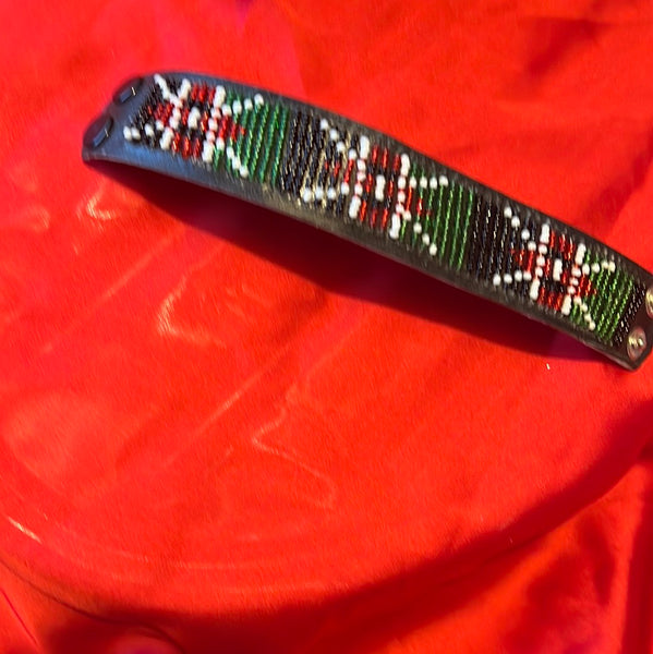 Beaded wrist band with a leather strap