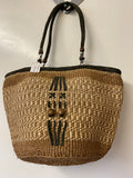 Kenyan sisal kiondo with a short leather handle. Beads and leather strips at the front.